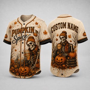 May include: A beige baseball jersey featuring a skeleton wearing a beanie and scarf, holding a mug. The front displays the text PUMPKIN SPICE, while the back shows CUSTOM NAME above a skeleton with pumpkins and books labeled POTIONS, CURSES, SPELLS.