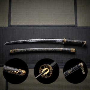 May include: A Japanese katana sword with a black handle and scabbard, accented with gold-colored metal fittings. The blade is silver with etched designs. The sword is displayed on a dark surface with a traditional Japanese background.