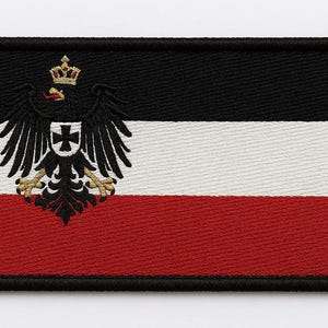 May include: Embroidered patch featuring the flag of the German Empire. The design includes black, white, and red horizontal stripes, with a black eagle emblem and a crown in the upper left corner. The patch has a black border.