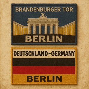 May include: Two embroidered patches. The top patch features the Brandenburg Gate with the text "BRANDENBURGER TOR" and "BERLIN". The bottom patch displays the German flag with the text "DEUTSCHLAND-GERMANY" and "BERLIN".