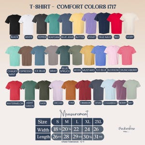 May include: A display of Comfort Colors 1717 t-shirts in various colors, including black, white, and red. The image shows a size chart with measurements in inches, ranging from S to 2XL. The width ranges from 18 1/4 to 26 inches.