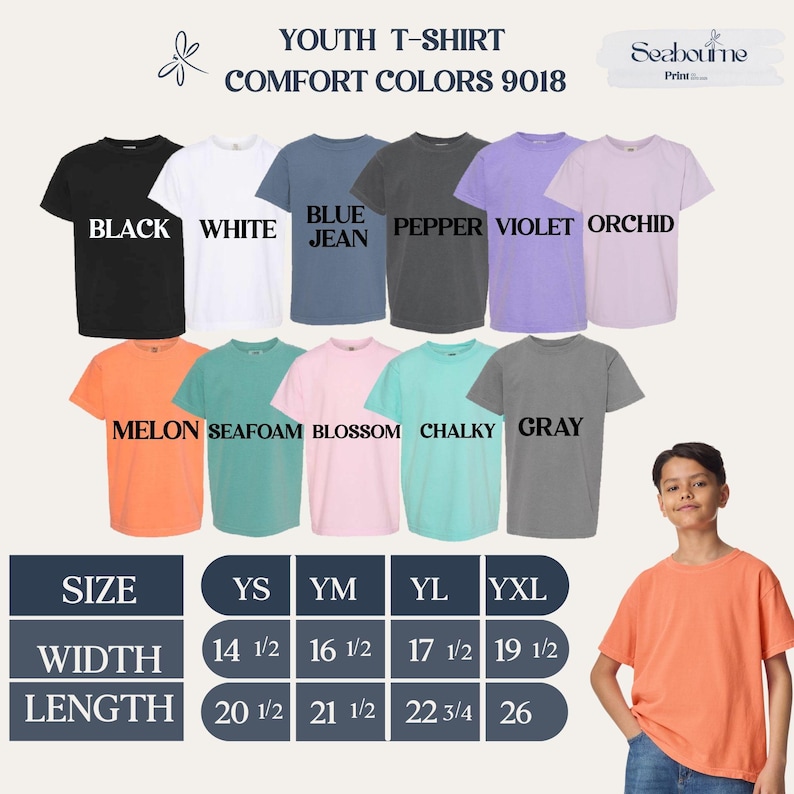 May include: A display of youth t-shirts in various colors, including black, white, blue jean, pepper, violet, orchid, melon, seafoam, blossom, chalky, and gray. The shirts are labeled with sizes and measurements in inches.