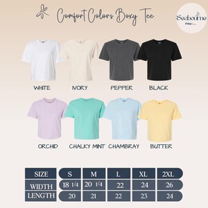 May include: A display of Comfort Colors Boxy Tee shirts in various colors: white, ivory, pepper, black, orchid, chalky mint, chambray, and butter. The image includes a size chart with measurements in inches.