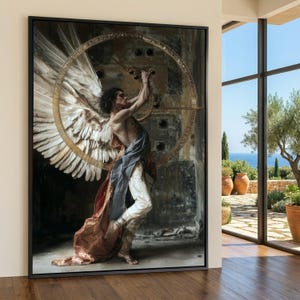 May include: A framed wall art print depicting a figure with large white feathered wings, wearing a draped blue and orange fabric over white trousers. The figure stands before a large circular golden mechanical structure against a dark background.