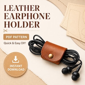 May include: A tan leather earphone holder with a brass snap button, securing a coiled black wired earphone set. The image includes text reading LEATHER EARPHONE HOLDER, PDF PATTERN, Quick & Easy DIY, and INSTANT DOWNLOAD with a download icon.