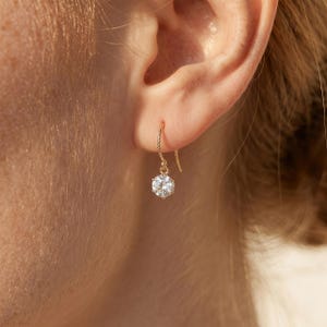 May include: A rustic wooden sign with the text "Welcome to our home" in white lettering. The sign features a distressed finish and a simple, inviting design, perfect for a front porch or entryway.