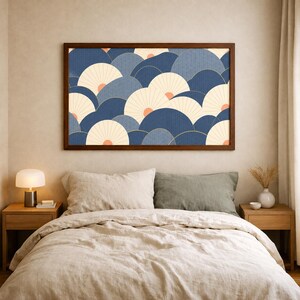 May include: A rectangular wall art piece in a dark wood frame featuring a repeating pattern of overlapping semicircular fan shapes in shades of navy blue, slate blue, and cream, with small coral-colored accents at the base of each fan.