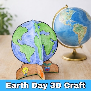May include: A colorful Earth Day 3D craft featuring a paper globe with blue oceans and green continents. The craft is displayed next to a globe on a gold stand. The base of the craft has drawings of a lightbulb, a heart, and a plant. The text "Earth Day 3D Craft" is at the bottom.