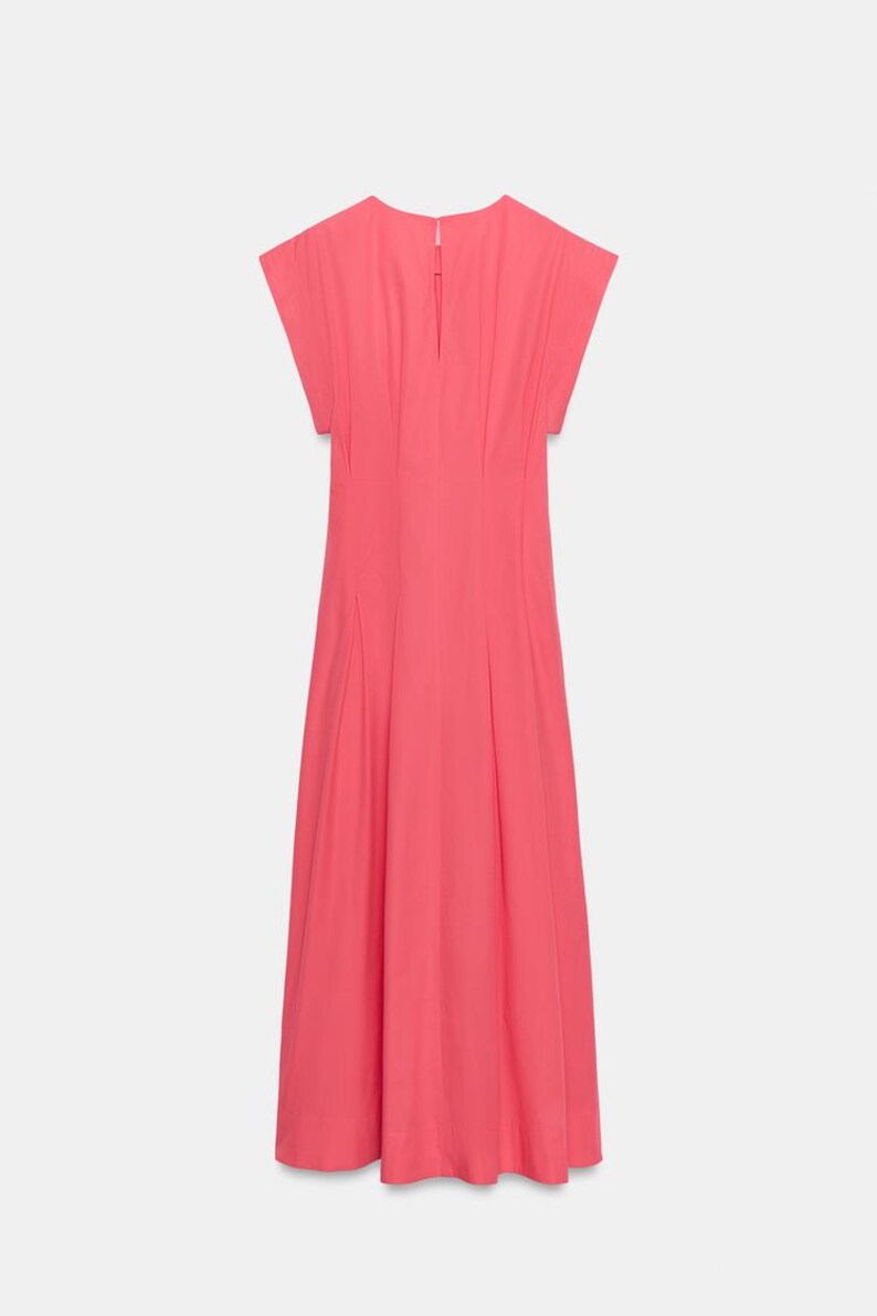 May include: A solid coral pink midi dress featuring short cap sleeves, a round neckline, and a vertical keyhole opening at the upper back. The garment has a fitted bodice with subtle vertical pleats that transition into a flared skirt.