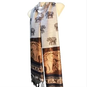 May include: A long rectangular scarf featuring a light gray background with a repeating pattern of dark gray elephants. The bottom section displays a wide brown border with large tan elephant illustrations and a dark patterned trim with fringe.