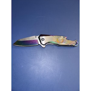 Falcon USA Designed 440 Stainless Folding Knife with a rainbow titanium Blade