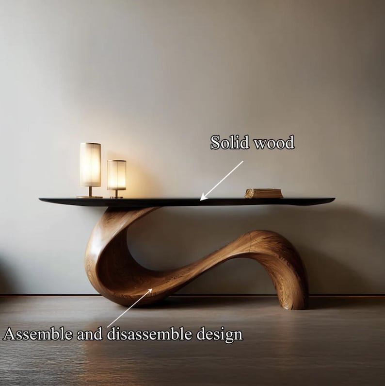 May include: A contemporary console table crafted from solid wood, showcasing a distinctive, fluid design. It has a dark, rectangular top and a sculptural, curved base. The text "Assemble and disassemble design" is visible. Two small lamps are on the table.