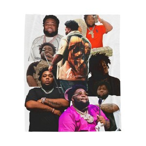 May include: A white blanket featuring a collage of images of a man in various poses and outfits. The images include the man wearing a pink shirt, a black shirt, and a shirt with a graphic design. The blanket has a soft, plush appearance.