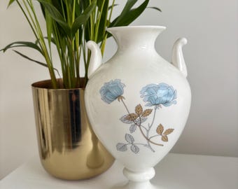 Vintage Wedgwood urn shaped vase featuring the delicate blue floral "Ice Rose" pattern and is crafted from white bone china