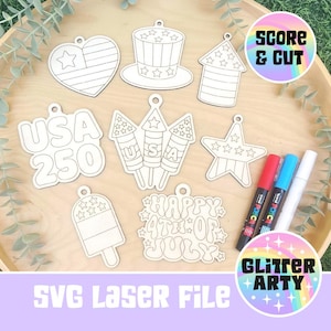 May include: A collection of eight laser-cut wooden shapes featuring patriotic designs including a heart, top hat, rocket, star, popsicle, and text reading USA 250 and Happy 4th of July. Three markers in red, blue, and white are included for decoration.
