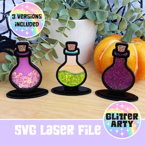 Könnte beinhalten: Drei dekorative Flaschenausschnitte mit Glitzer- und Paillettendetails. Die Flaschen sind in Pink, Gelbgrün und Lila gehalten. Jede Flasche hat einen schwarzen Sockel und einen Korken. Der Text "3 VERSIONS INCLUDED" und "SVG Laser File" ist enthalten.