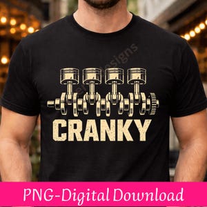 May include: Black t-shirt featuring a graphic of an engine's pistons and crankshaft. The word "CRANKY" is printed in a bold, vintage font below the engine design. The shirt is a digital download.