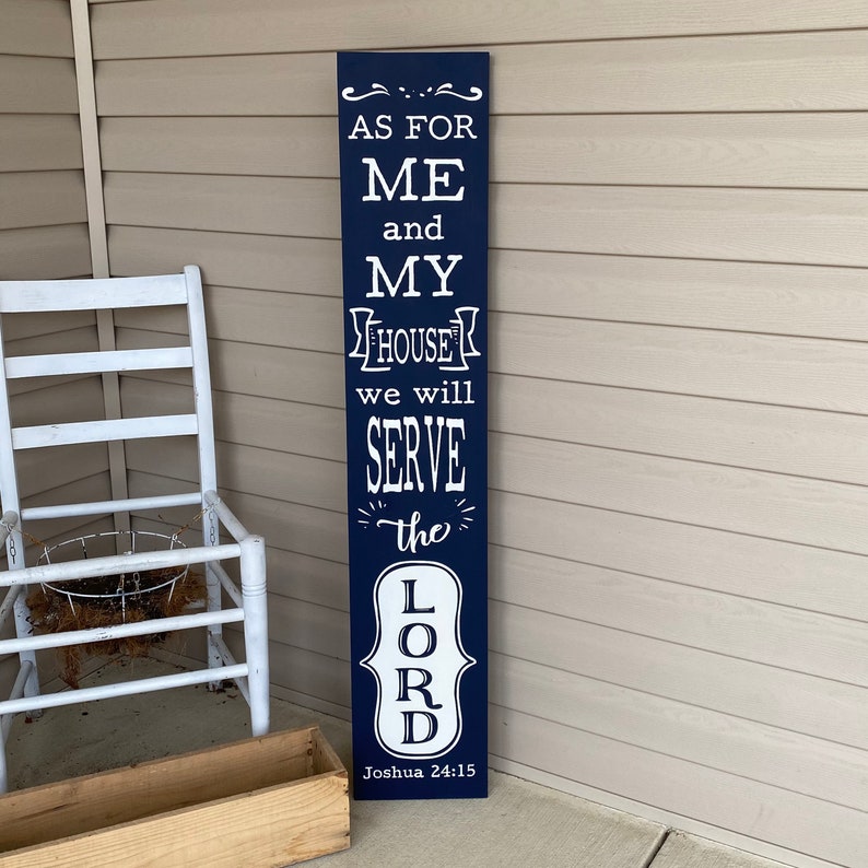 May include: A navy blue wooden sign with white text that reads "As for me and my house we will serve the Lord, Joshua 24:15".