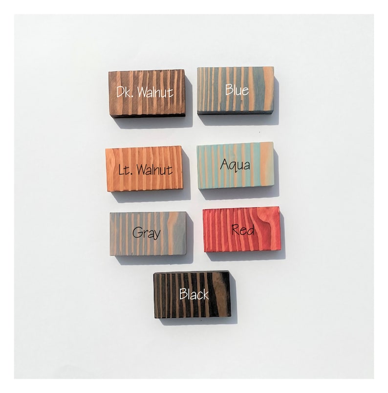 May include: Wood samples stained in various colors, including dark walnut, light walnut, gray, blue, aqua, red, and black.