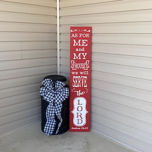 May include: Red wooden sign with white text that reads "As for me and my house we will serve the Lord, Joshua 24:15".