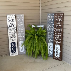 May include: Four wooden signs with white text on a gray, brown, and white background. The signs read "As for me and my house we will serve the Lord" with the scripture reference "Joshua 24:15".