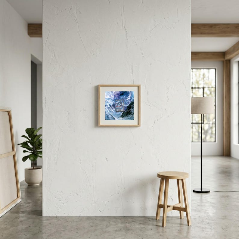 May include: A square framed print featuring a swirling abstract design in shades of deep blue, purple, and white, mounted on a textured white wall. The artwork displays a central rectangular graphic element with intricate patterns and dark mountain silhouettes.