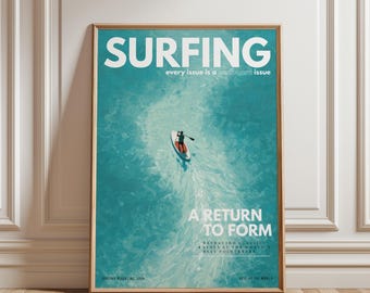 May include: A framed poster with the word "SURFING" in large white letters at the top. The poster features a person on a paddleboard in turquoise water, with the text "A RETURN TO FORM" below. The poster is in a wooden frame.