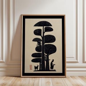 May include: Black and beige framed art print featuring a stylized illustration of trees, a person, and animals. The artwork has a minimalist aesthetic with a black and beige color palette. The print is displayed in a room with a wooden floor and white walls.