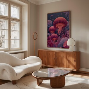 May include: A living room scene featuring a large framed artwork with a jellyfish theme. The artwork has a dark background with pink and purple jellyfish. The room also includes a white sofa, wooden cabinet, and a round coffee table.