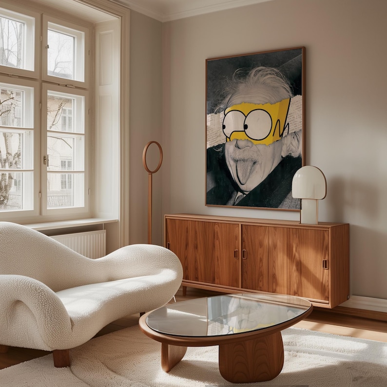 May include: A living room interior with a framed artwork depicting Albert Einstein with cartoon eyes. The room includes a wooden cabinet, a white lamp, a modern white sofa, and a wooden coffee table with a glass top. The room has a neutral colour palette.