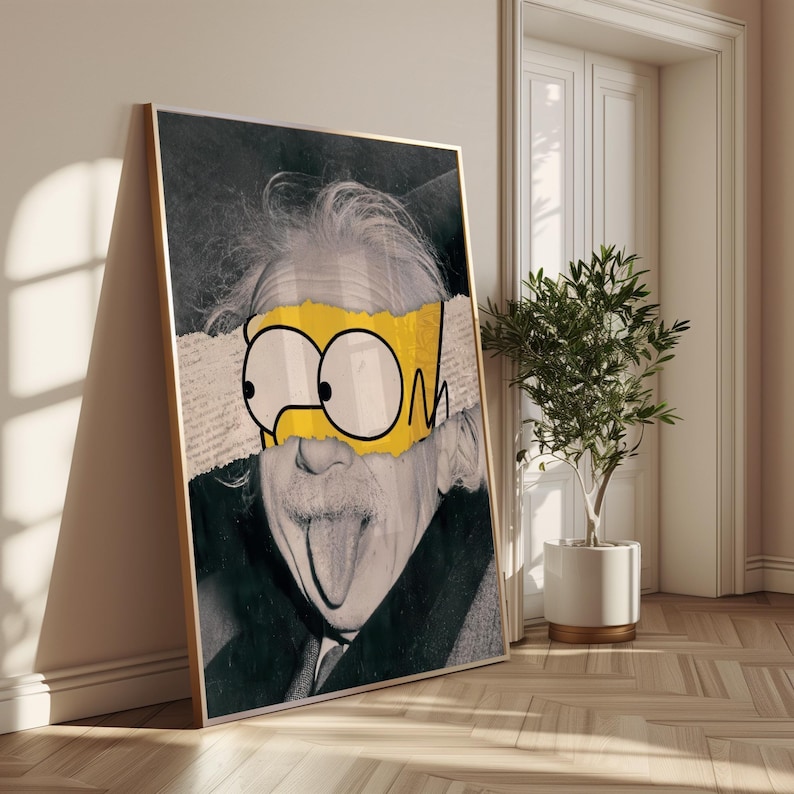 May include: Framed art print depicting Albert Einstein in black and white, overlaid with a yellow and white cartoon element. The artwork leans against a wall, with a small potted plant and a door visible in the background.