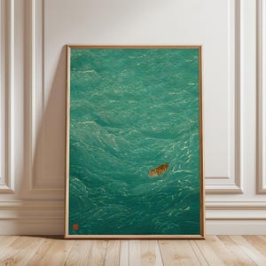 May include: Framed art print featuring a tiger swimming in a teal ocean. The artwork has a vintage aesthetic with detailed wave patterns and a warm-toned wooden frame. A red stamp is in the lower left corner.