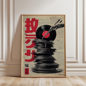 May include: A framed art print featuring a stack of vinyl records with a record being held by chopsticks. The background is a collage of newspaper clippings with red Japanese characters. The print is in a wooden frame.