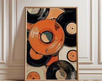May include: Abstract art print featuring a collection of vinyl records in shades of orange, black, and cream. The artwork is framed in a light wood frame and leans against a white wall and wooden floor.