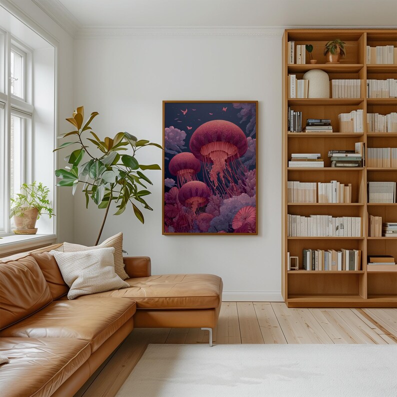 May include: A framed art print featuring a vibrant illustration of several jellyfish in shades of red and purple. The artwork is set against a dark blue background with hints of other marine life. The print is displayed in a living room setting.