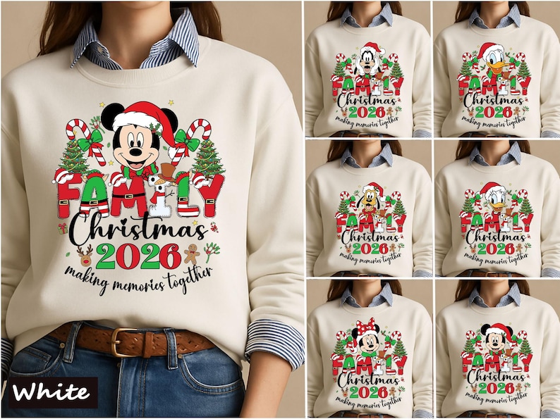 May include: A cream-colored sweatshirt featuring a graphic of Mickey Mouse in a Santa hat, surrounded by Christmas trees, candy canes, and the text "FAMILY Christmas 2026 making memories together." The design includes various Disney characters.