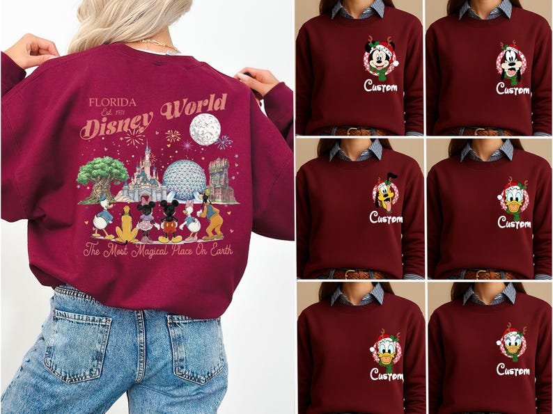 May include: A maroon long-sleeve sweatshirt featuring a large back graphic of Disney World landmarks and characters with the text Florida Est. 1971 Disney World The Most Magical Place On Earth. The front chest displays a small character and Custom text.