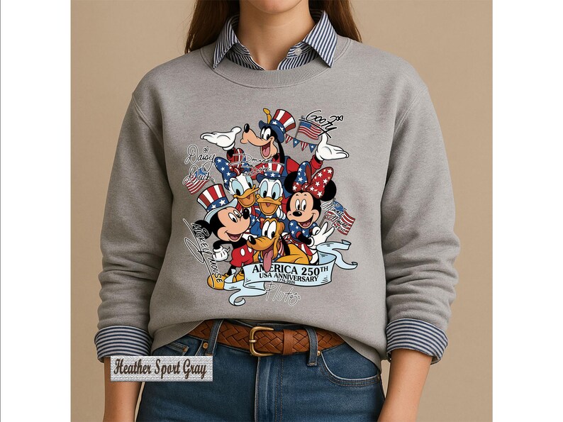 May include: A heather sport gray crewneck sweatshirt featuring a graphic of Disney characters including Mickey Mouse, Minnie Mouse, Donald Duck, Goofy, and Pluto wearing patriotic hats. The text reads America 250th USA Anniversary 1776-2026.