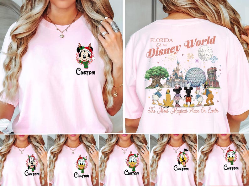 May include: A light pink t-shirt featuring a small graphic on the front left chest of a Disney character in a Christmas hat with the word Custom. The back displays Florida Est. 1971 Disney World with park icons and characters.