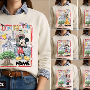 May include: A cream-colored crewneck sweatshirt featuring a graphic print with the text Disney Trip 2020, a castle, a large tree, and various Disney characters including Mickey Mouse, Pluto, Goofy, Donald Duck, Daisy Duck, and Minnie Mouse.