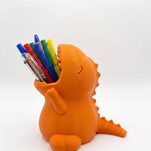 3D-geprinte pennenhouder in de vorm van een T-Rex dinosaurus | Leuke dinosaurus-wattenstaafjesdispenser | Badkamerorganizer | Uniek en grappig cadeau voor kinderen en kantoor