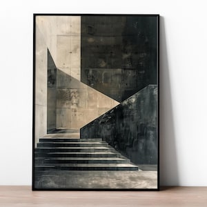 Puede incluir: Una impresión de arte mural vertical enmarcada que presenta una escena arquitectónica monocromática de escaleras de hormigón. La composición muestra sombras geométricas nítidas proyectadas sobre paredes grises lisas, creando un contraste marcado.