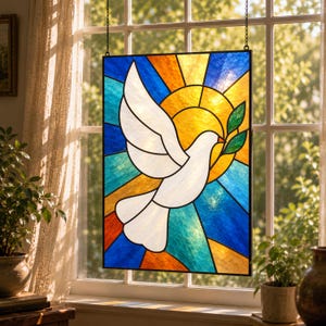 May include: A rectangular stained glass panel featuring a white dove in flight holding a green olive branch. The background consists of geometric segments in shades of blue, yellow, and orange, creating a sunburst effect behind the bird.