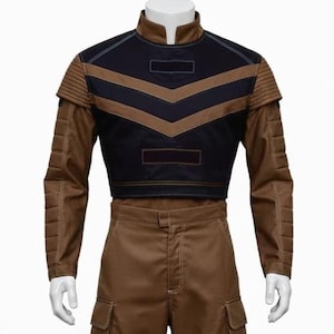 May include: A brown and black costume displayed on a mannequin. The outfit includes a jacket with a black upper section and brown chevron stripes, and matching brown pants with cargo pockets. The jacket has padded shoulder details.