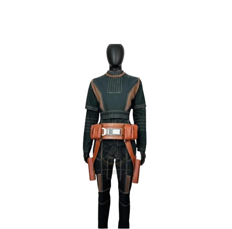 May include: A dark green long-sleeved jumpsuit featuring a high collar, structured shoulder panels, and vertical stitching details. The outfit includes a wide tan utility belt with multiple attached pouches and a central metallic buckle.