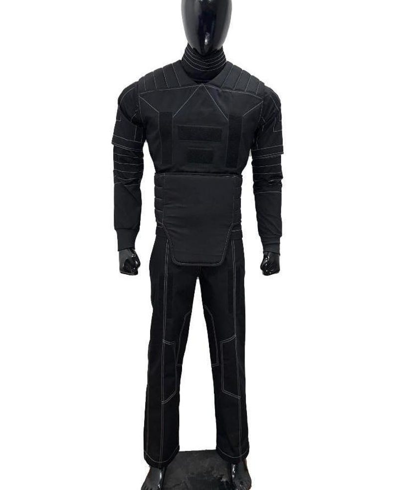 May include: Black tactical suit displayed on a mannequin. The suit includes a long-sleeved top with reinforced panels and white stitching, and matching pants. The mannequin is black, and the background is white.