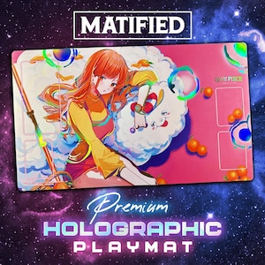 May include: A premium holographic playmat featuring anime artwork. The playmat has a pink background with an illustration of a character with orange hair and a cloud. The text "MATIFIED" and "ONE PIECE CARD GAME" are visible.