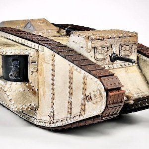 May include: A scale model of a World War I Mark IV tank featuring a weathered off-white hull with visible rivets, dark brown rusted tracks, and two side-mounted black cannons. The armored vehicle has a boxy structure with a front-facing gun port.