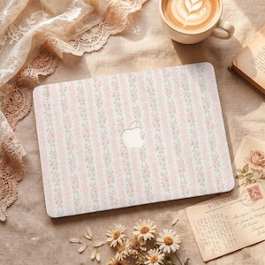 May include: A rectangular laptop cover featuring a repeating vertical pattern of soft pink stripes alternating with delicate green floral vines on a white background, centered with a circular cutout for an Apple logo on the top surface.