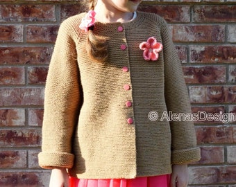 May include: A brown knitted cardigan with a button closure and a pink flower embellishment. The cardigan has long sleeves and a relaxed fit. The model is wearing a pink skirt.